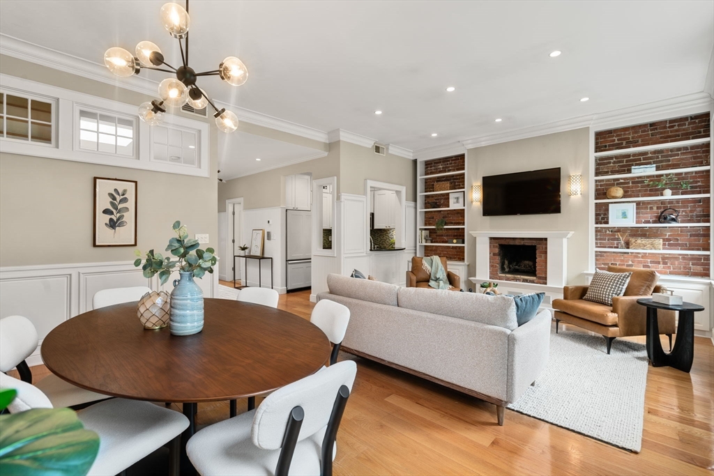 82 Berkeley Street, Unit 5 Boston, MA 02116 - Photo 2 of 31 a living room with fireplace furniture and a flat screen tv