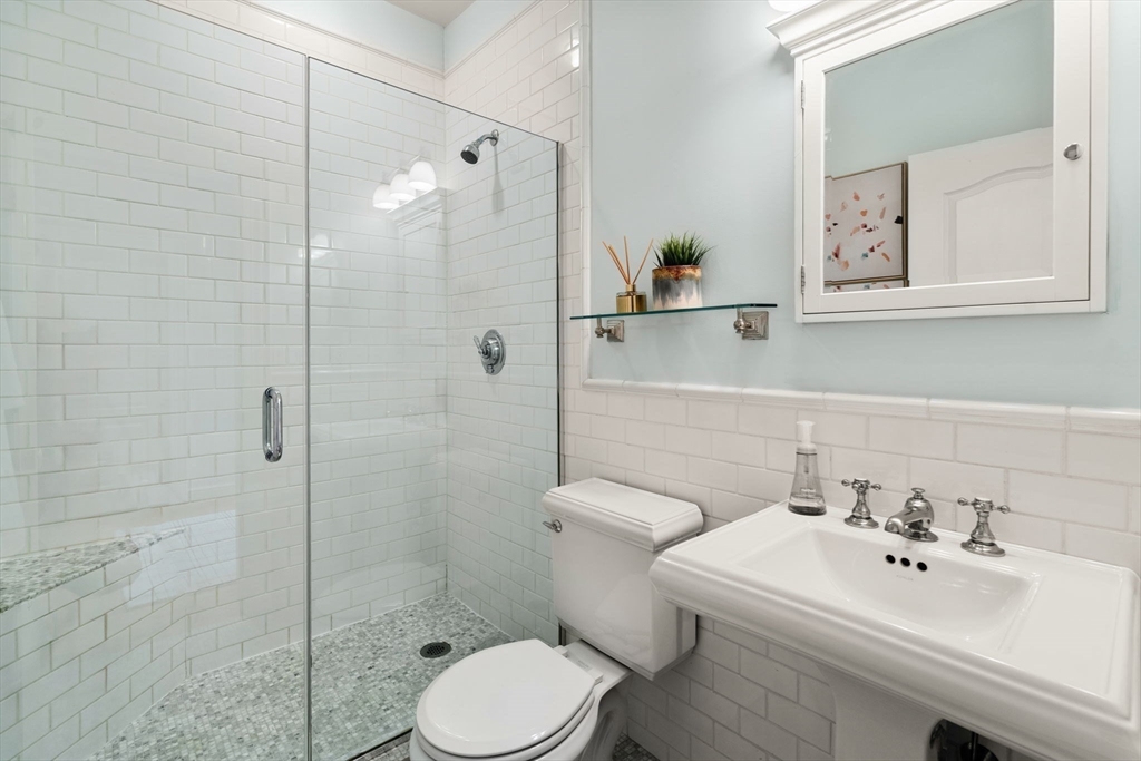 82 Berkeley Street, Unit 5 Boston, MA 02116 - Photo 22 of 31 a bathroom with a sink toilet and shower