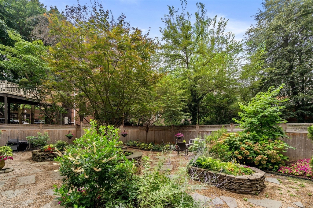 82 Berkeley Street, Unit 5 Boston, MA 02116 - Photo 26 of 31 a backyard of a house with lots of green space