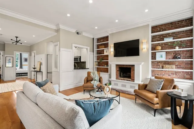 a living room with furniture fireplace and a flat screen tv
