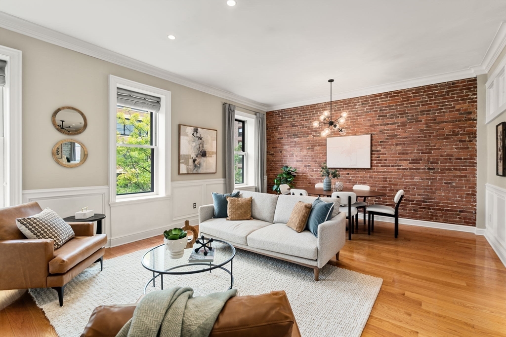 82 Berkeley Street, Unit 5 Boston, MA 02116 - Photo 9 of 31 a living room with furniture and wooden floor