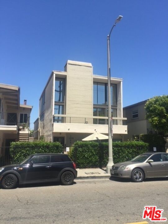 a view of street with parked cars