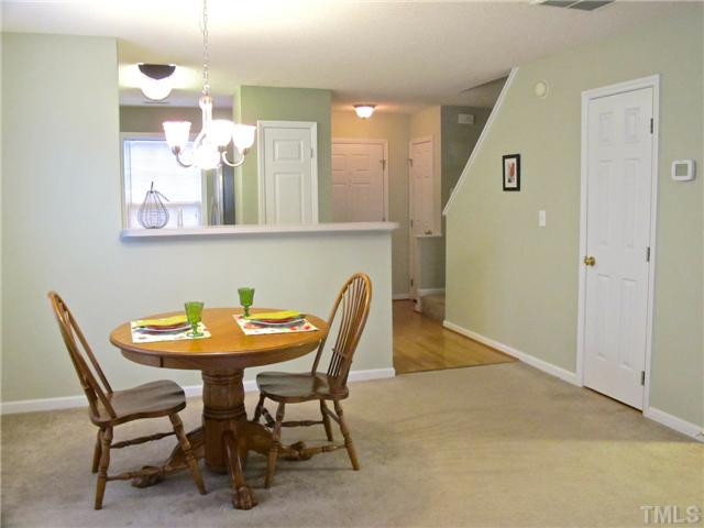 The large dining room area is attached to the living room and open to the kitchen, offering the most in design flexibility. Add stools to the elevated bar overlooking the kitchen for more informal dining. Dining Room