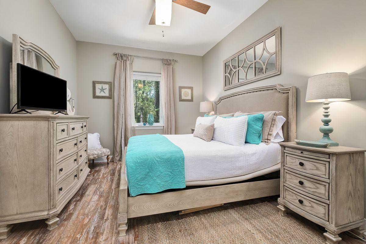231 Somerset Bridge Road, Unit 2205 Santa Rosa Beach, FL 32459 - Photo 12 of 40 a bedroom with a bed and a flat tv screen on dresser