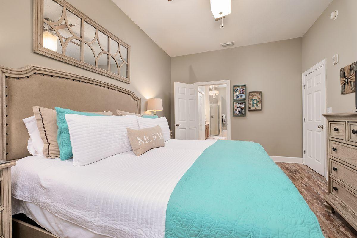 231 Somerset Bridge Road, Unit 2205 Santa Rosa Beach, FL 32459 - Photo 13 of 40 a bedroom with a bed and a cabinets