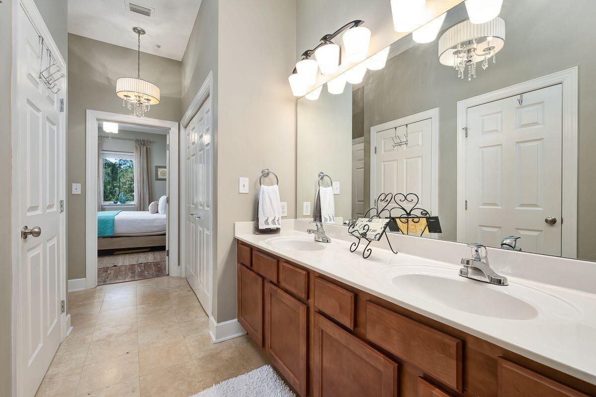 231 Somerset Bridge Road, Unit 2205 Santa Rosa Beach, FL 32459 - Photo 14 of 40 a en suite bathroom with a double vanity sink and a mirror