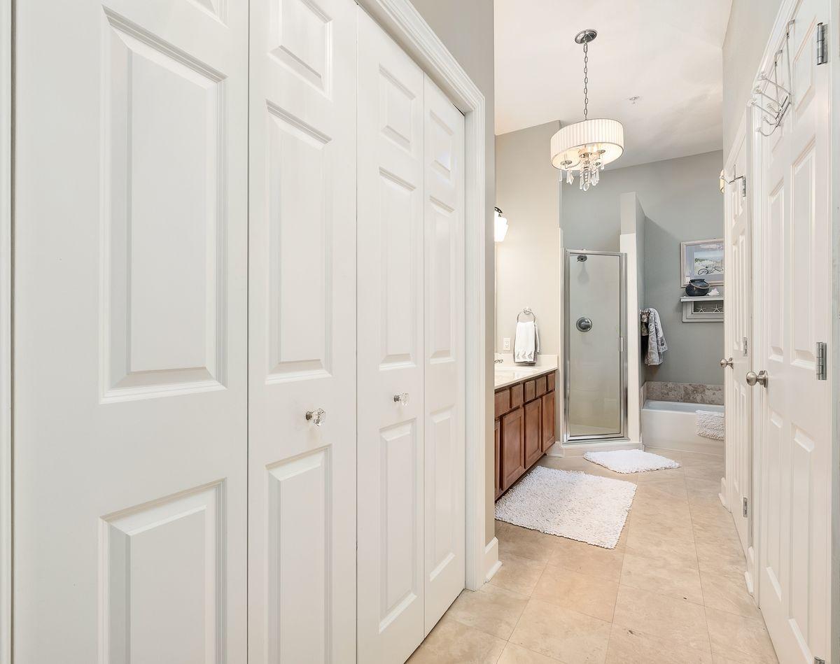 231 Somerset Bridge Road, Unit 2205 Santa Rosa Beach, FL 32459 - Photo 15 of 40 a view of a hallway with a chandelier