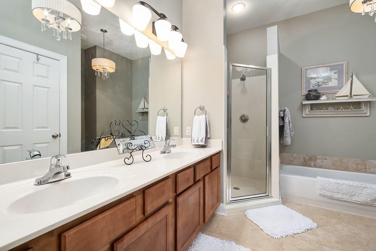 231 Somerset Bridge Road, Unit 2205 Santa Rosa Beach, FL 32459 - Photo 16 of 40 a bathroom with a sink a large mirror and a shower