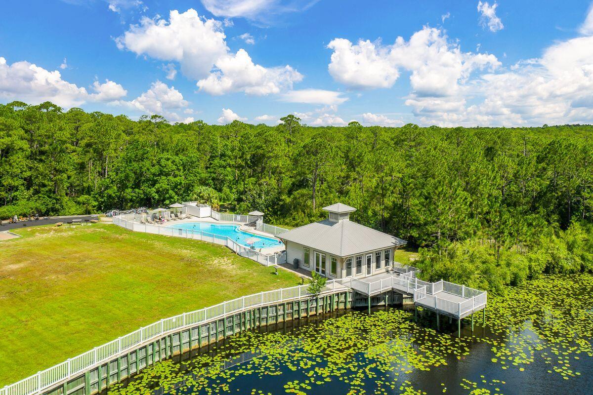 231 Somerset Bridge Road, Unit 2205 Santa Rosa Beach, FL 32459 - Photo 20 of 40 a view of a patio with furniture and a garden