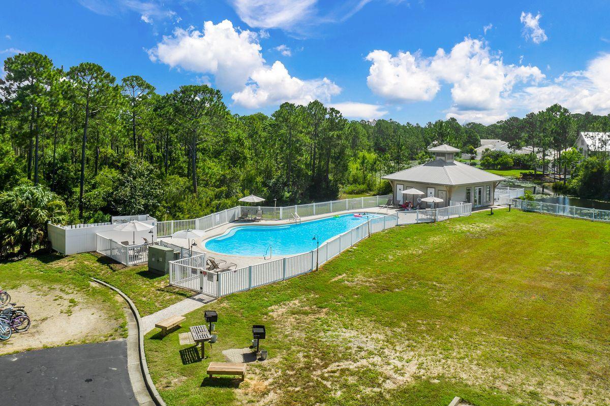 231 Somerset Bridge Road, Unit 2205 Santa Rosa Beach, FL 32459 - Photo 22 of 40 a view of a swimming pool with a yard