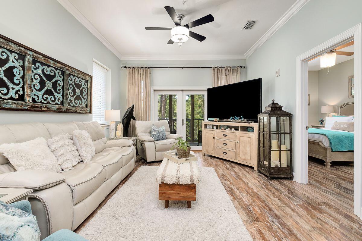 231 Somerset Bridge Road, Unit 2205 Santa Rosa Beach, FL 32459 - Photo 3 of 40 a living room with furniture and a flat screen tv