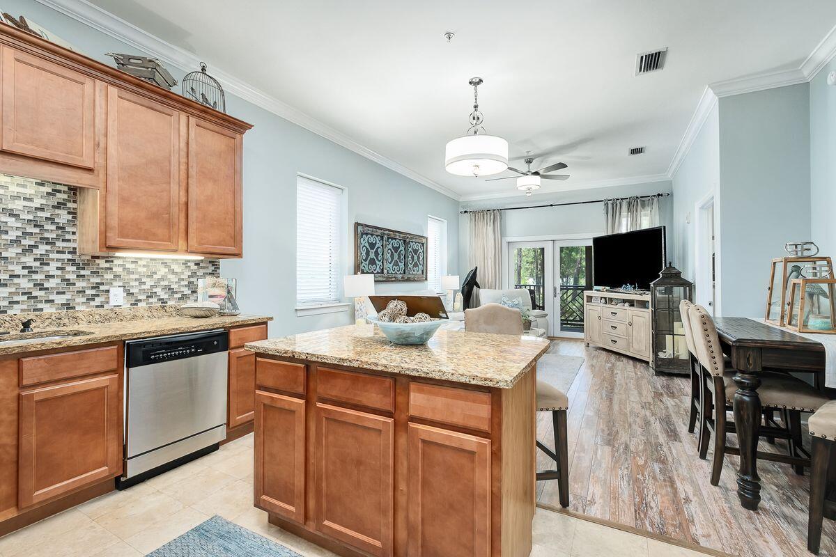231 Somerset Bridge Road, Unit 2205 Santa Rosa Beach, FL 32459 - Photo 5 of 40 a open kitchen with stainless steel appliances granite countertop a sink stove and refrigerator
