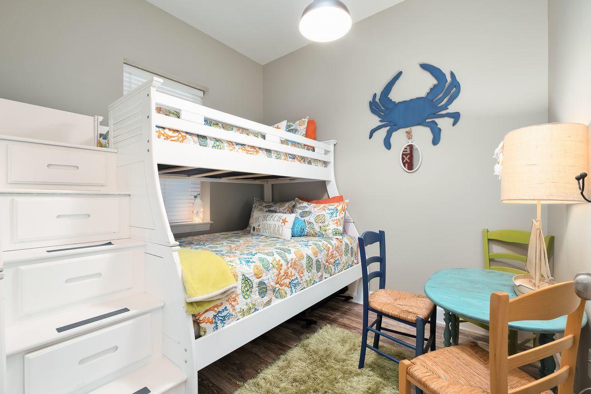 231 Somerset Bridge Road, Unit 2205 Santa Rosa Beach, FL 32459 - Photo 9 of 40 a bedroom with a bed and a table in it