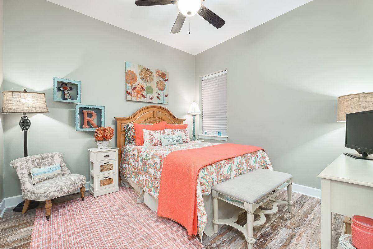231 Somerset Bridge Road, Unit 2205 Santa Rosa Beach, FL 32459 - Photo 10 of 40 a bedroom with a bed and a chandelier