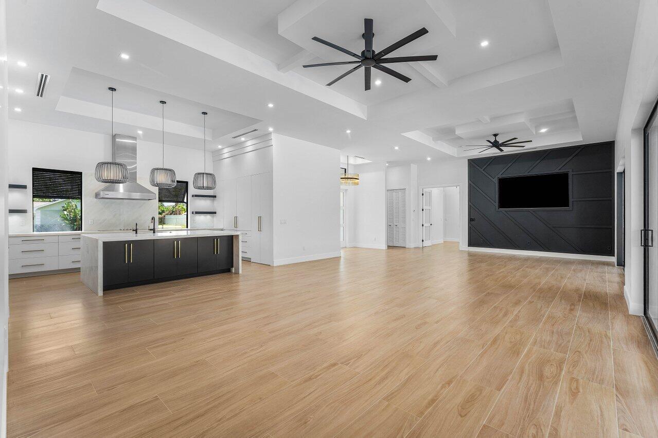 5701 Old Orange Road Jupiter, FL 33458 - Photo 7 of 46 a view of a kitchen with a sink and a microwave
