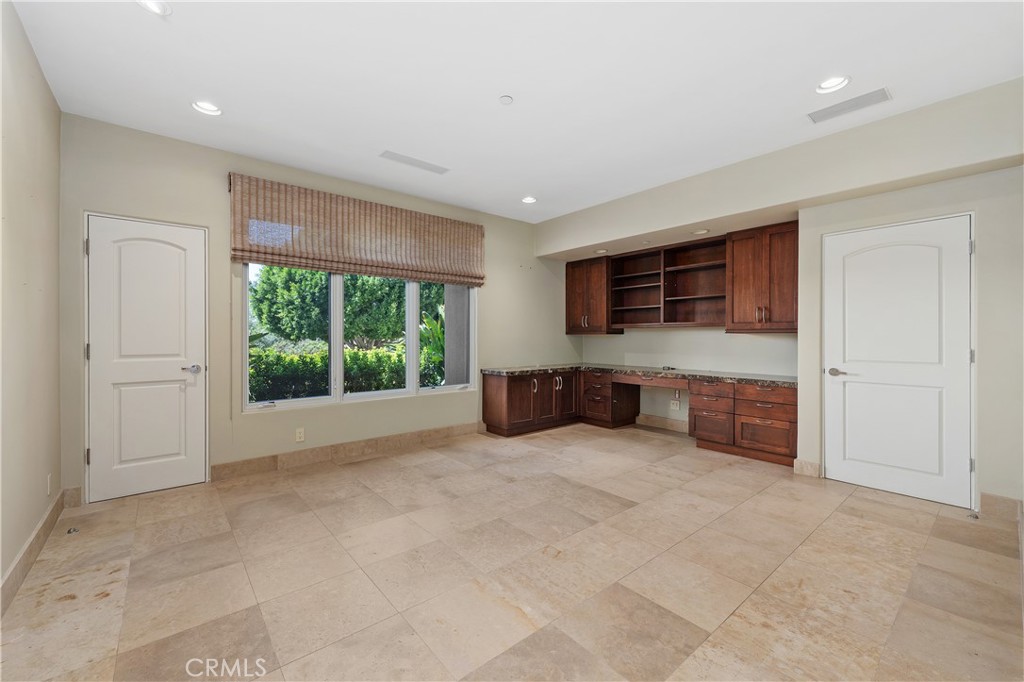 6533 Lago Lindo Rancho Santa Fe, CA 92067 - Photo 37 of 57 a large bedroom with furniture and a flat screen tv