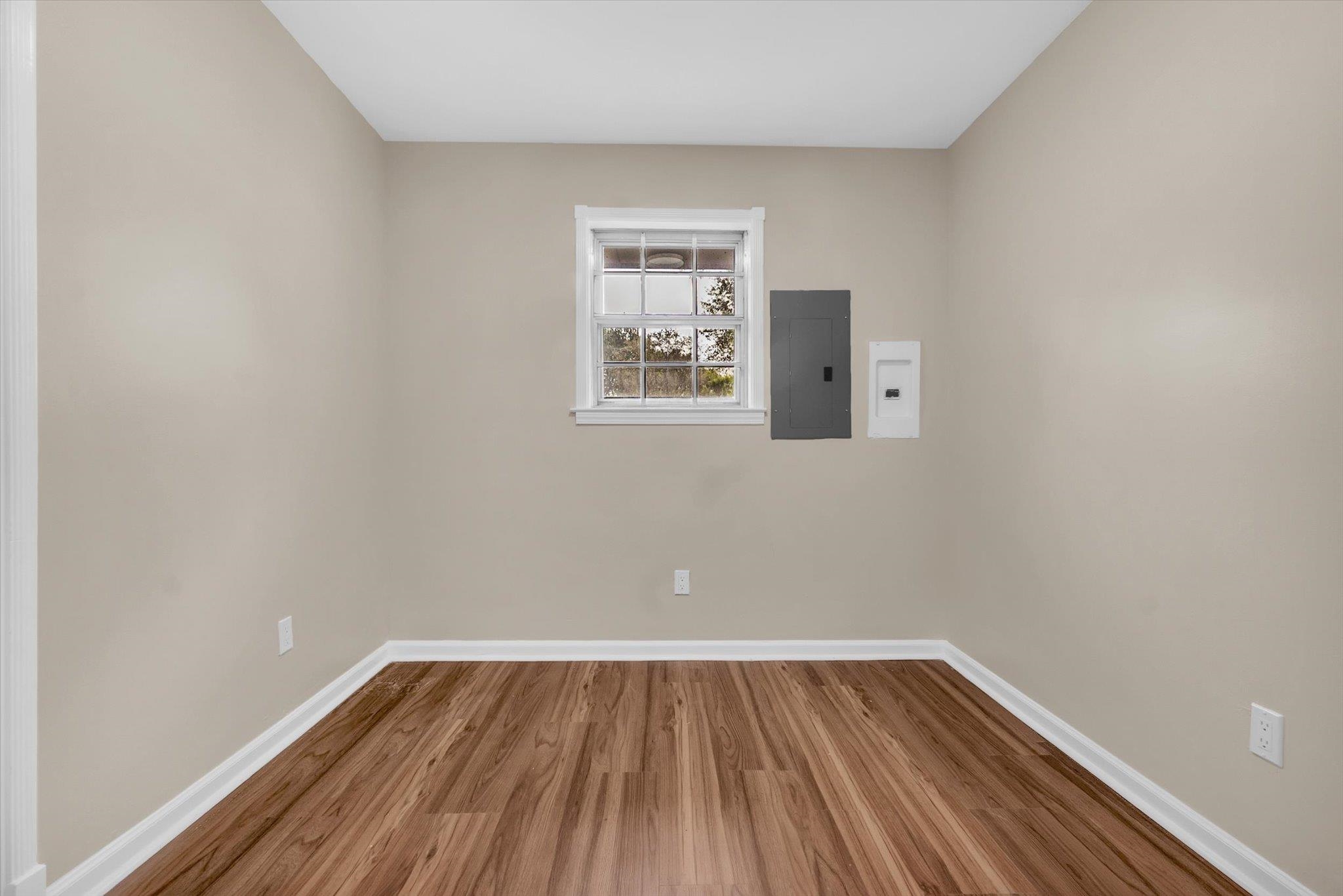5509 Rappahannock Drive Memphis, TN 38134 - Photo 12 of 27 Unfurnished room featuring electric panel and wood finished floors
