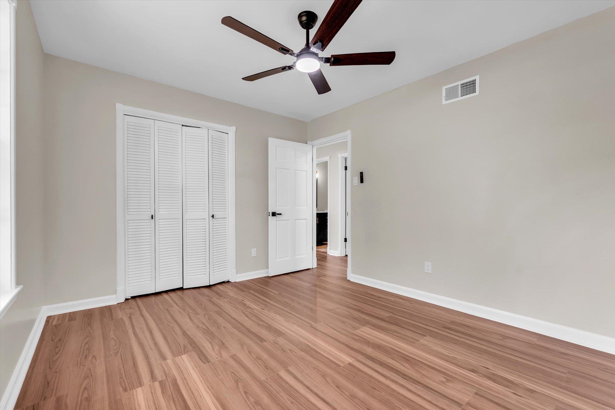 5509 Rappahannock Drive Memphis, TN 38134 - Photo 18 of 27 Unfurnished bedroom with light wood-type flooring, ceiling fan, and a closet