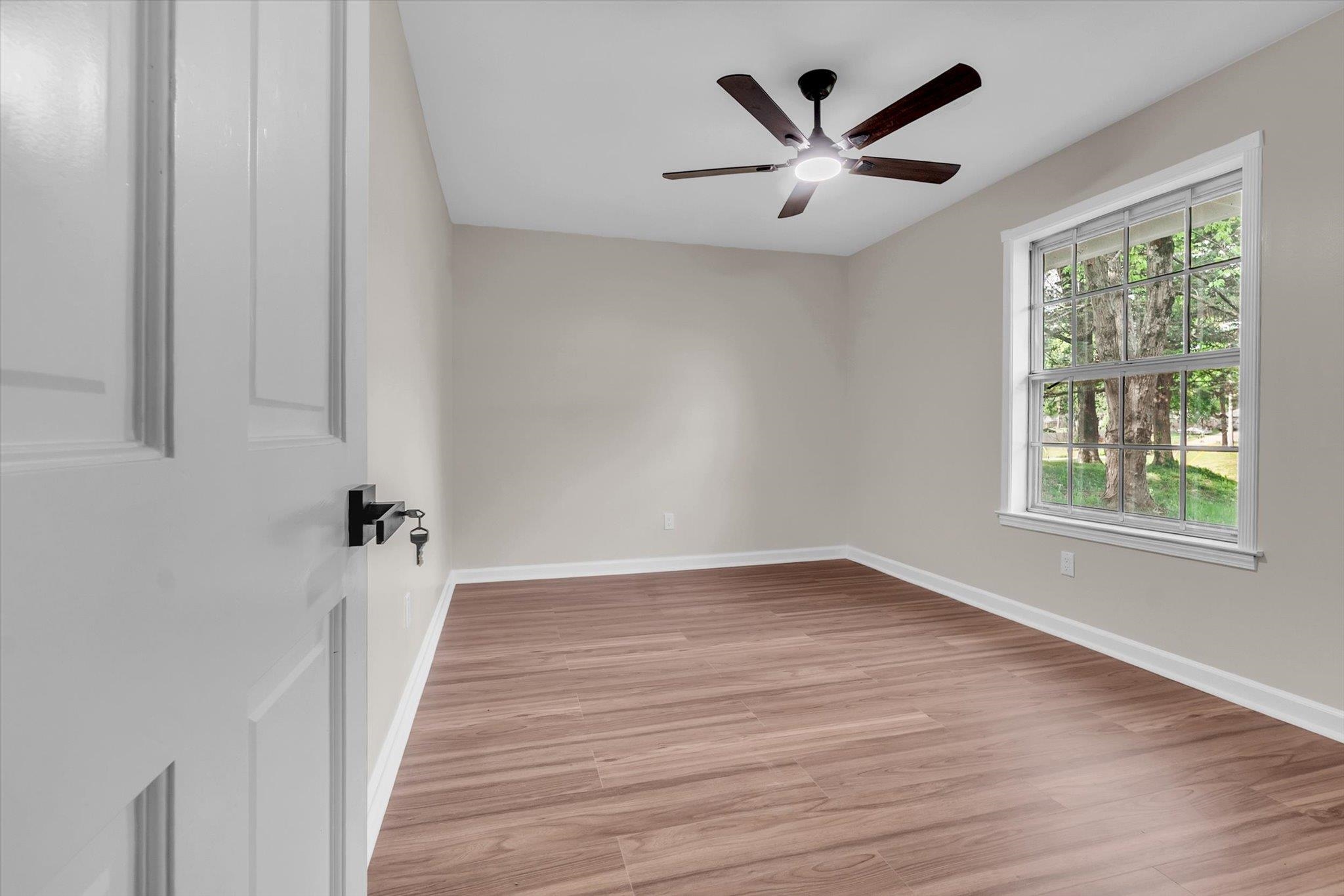 5509 Rappahannock Drive Memphis, TN 38134 - Photo 19 of 27 Spare room with light wood-type flooring and a ceiling fan