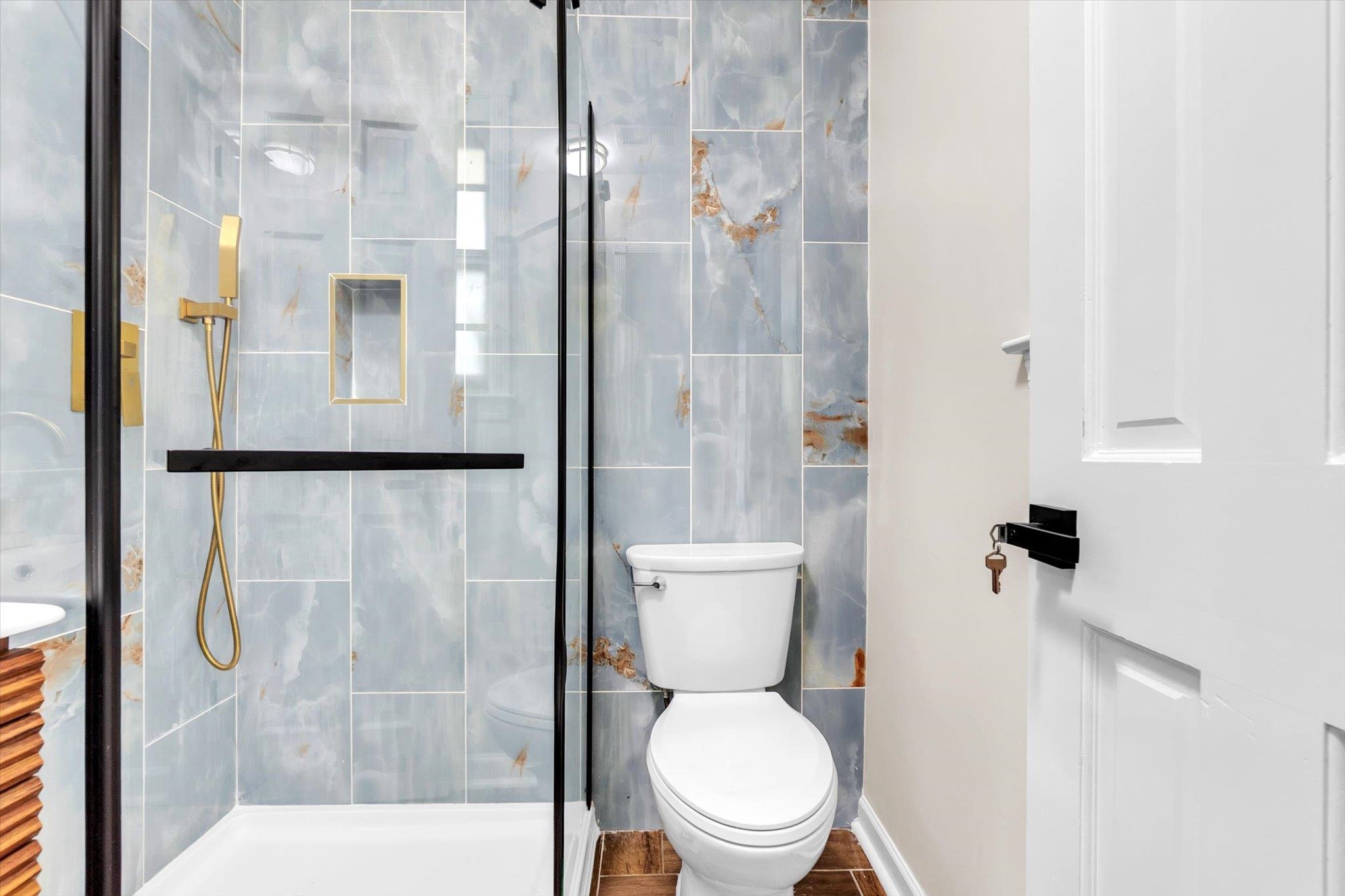 5509 Rappahannock Drive Memphis, TN 38134 - Photo 21 of 27 Bathroom featuring a stall shower, vanity, and tile walls