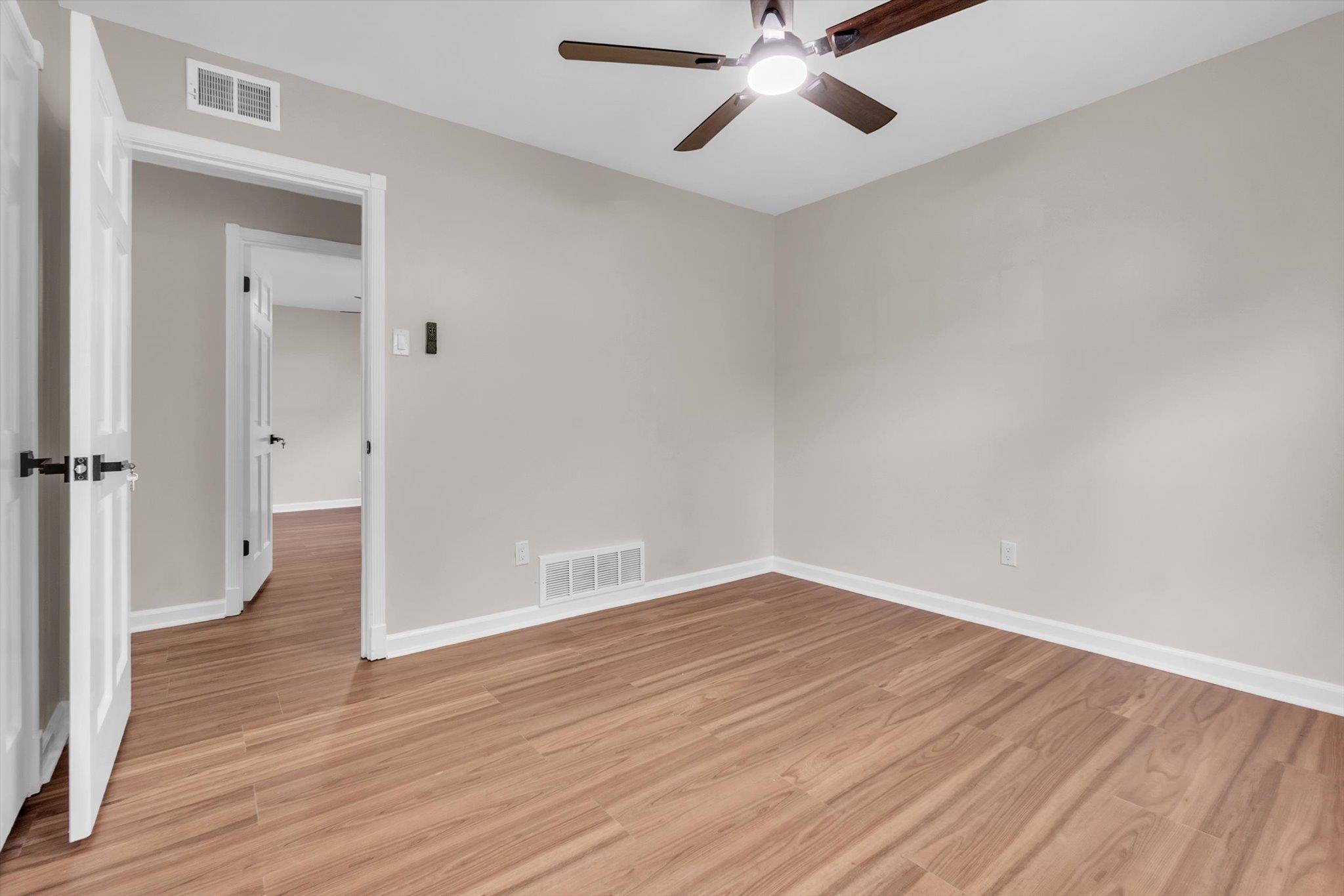 5509 Rappahannock Drive Memphis, TN 38134 - Photo 26 of 27 Neutral wall tones with wood-finish flooring