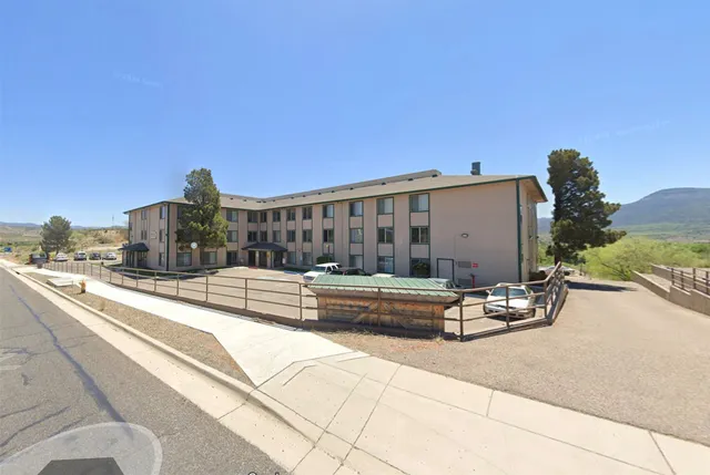 a car parked in front of a building