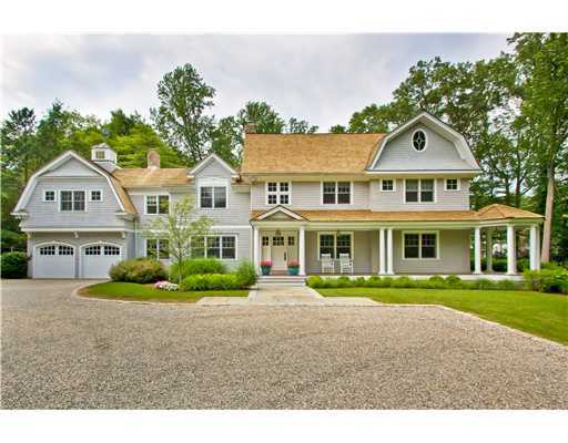 79 Stephen Mather Road Darien, CT 06820 - Photo 1 of 20 a front view of a house with a yard and potted plants