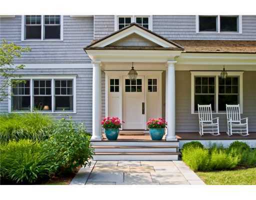 79 Stephen Mather Road Darien, CT 06820 - Photo 2 of 20 a front view of a house with potted plants