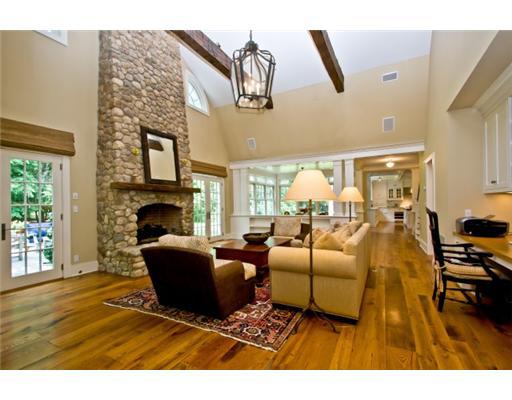 79 Stephen Mather Road Darien, CT 06820 - Photo 13 of 20 a living room with furniture a fireplace and a flat screen tv