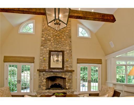 79 Stephen Mather Road Darien, CT 06820 - Photo 14 of 20 a living room with a fireplace and a window