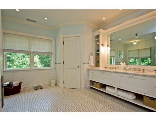 79 Stephen Mather Road Darien, CT 06820 - Photo 16 of 20 a bathroom with a tub double vanity sink and a large mirror