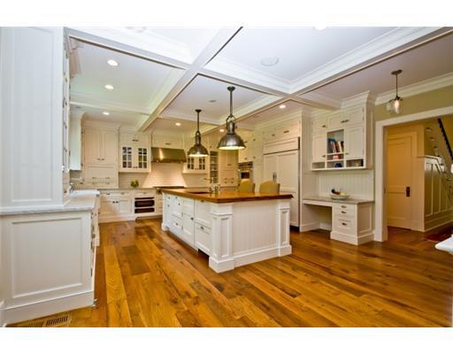 79 Stephen Mather Road Darien, CT 06820 - Photo 10 of 20 a large kitchen with cabinets and wooden floor