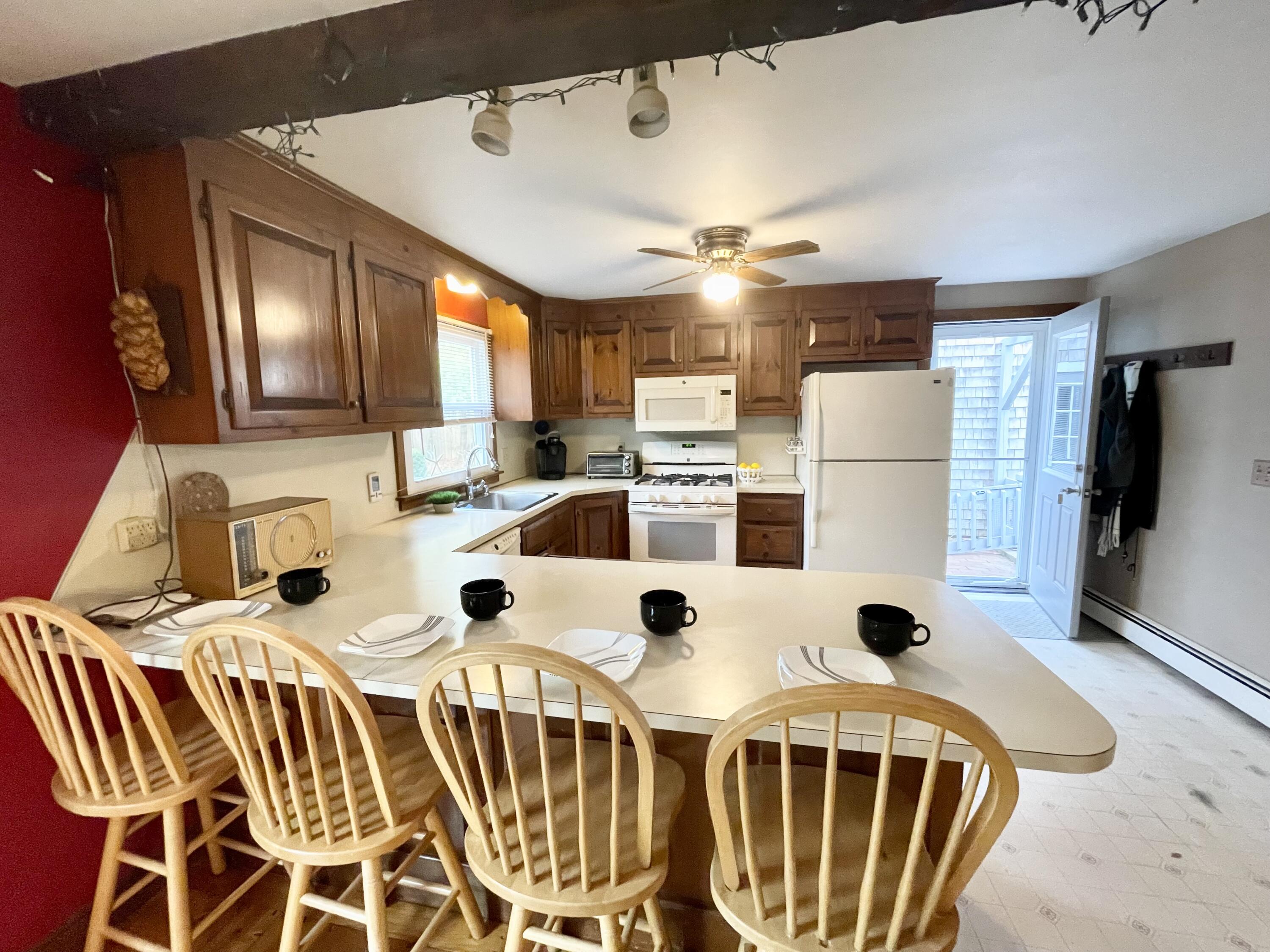 89 Sheaffer Road Centerville, MA 02632 - Photo 21 of 58 kitchen.4 person breakfast bar.gas stove