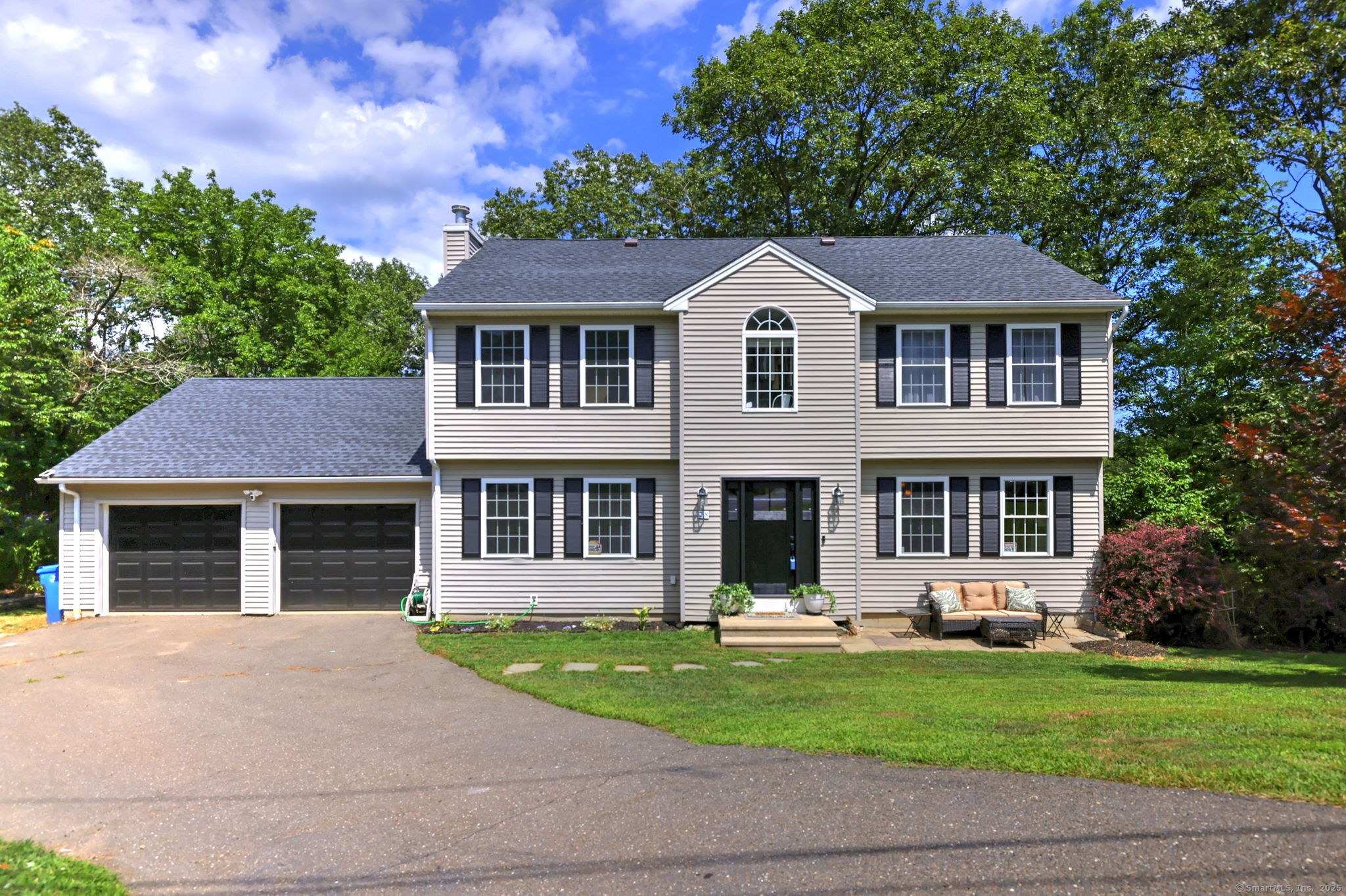 a front view of a house with a yard