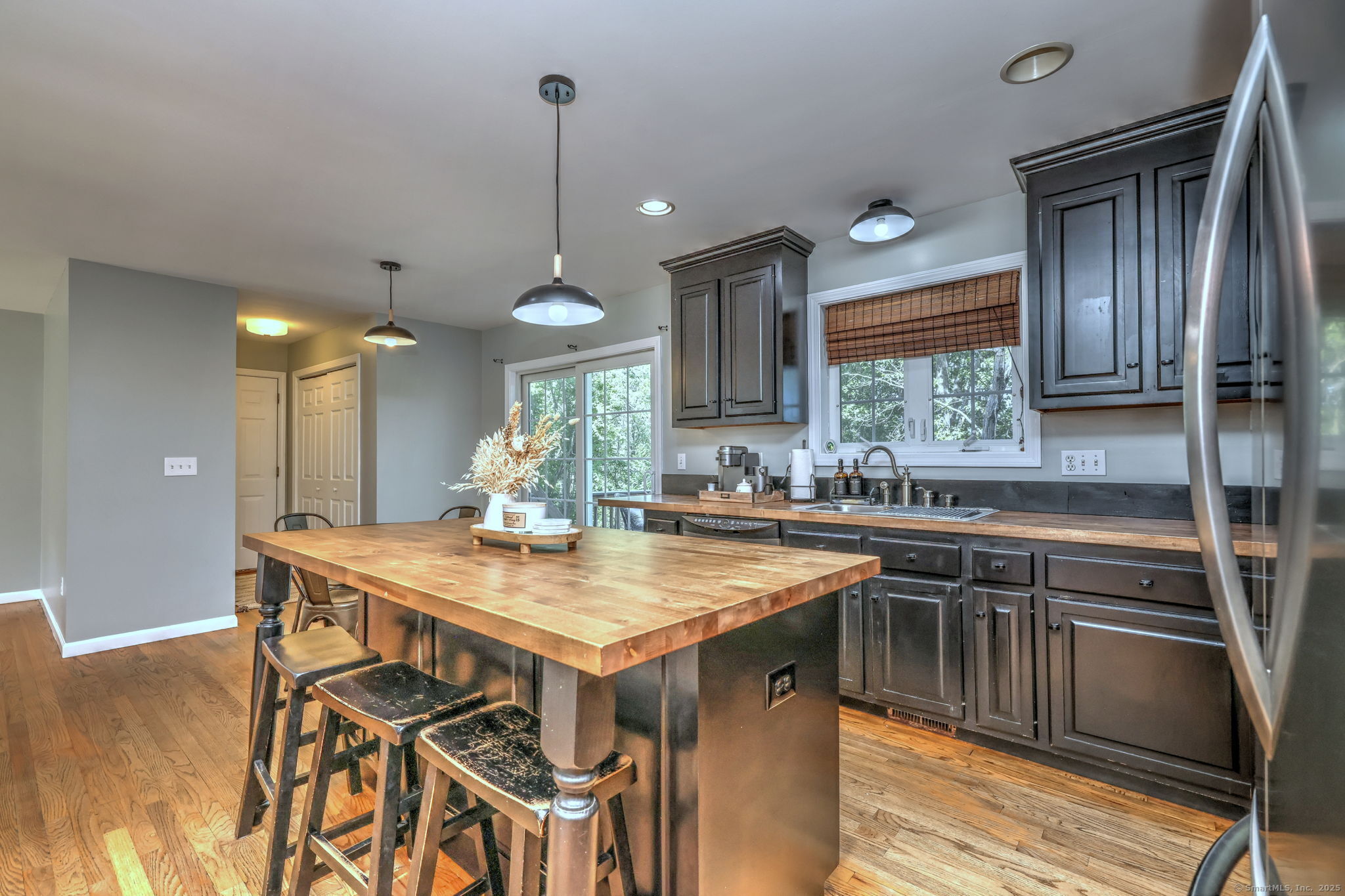 28 Edgewood Avenue Shelton, CT 06484 - Photo 19 of 40 a kitchen with a table chairs sink and cabinets