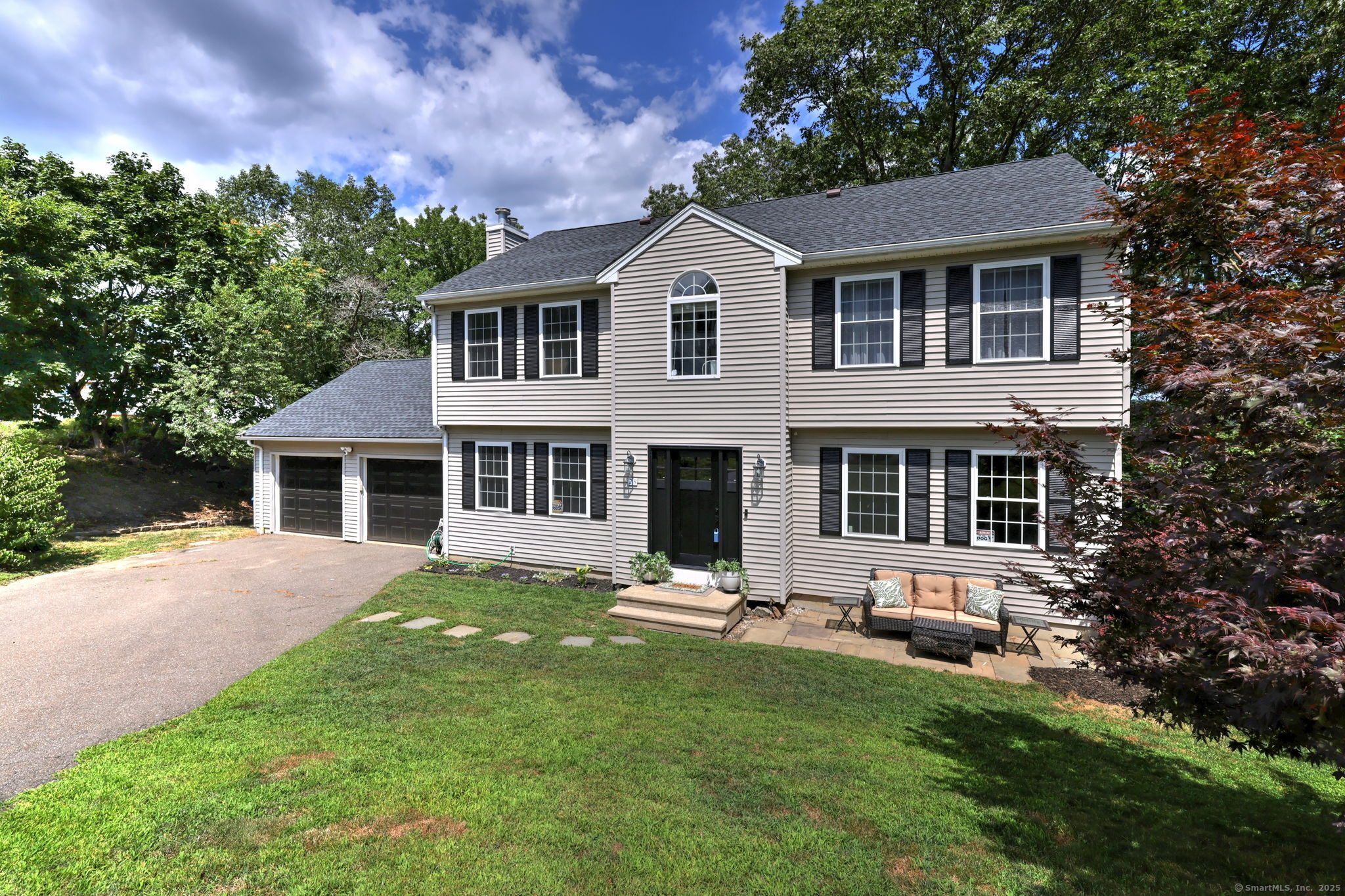 28 Edgewood Avenue Shelton, CT 06484 - Photo 2 of 40 a front view of a house with a yard and trees