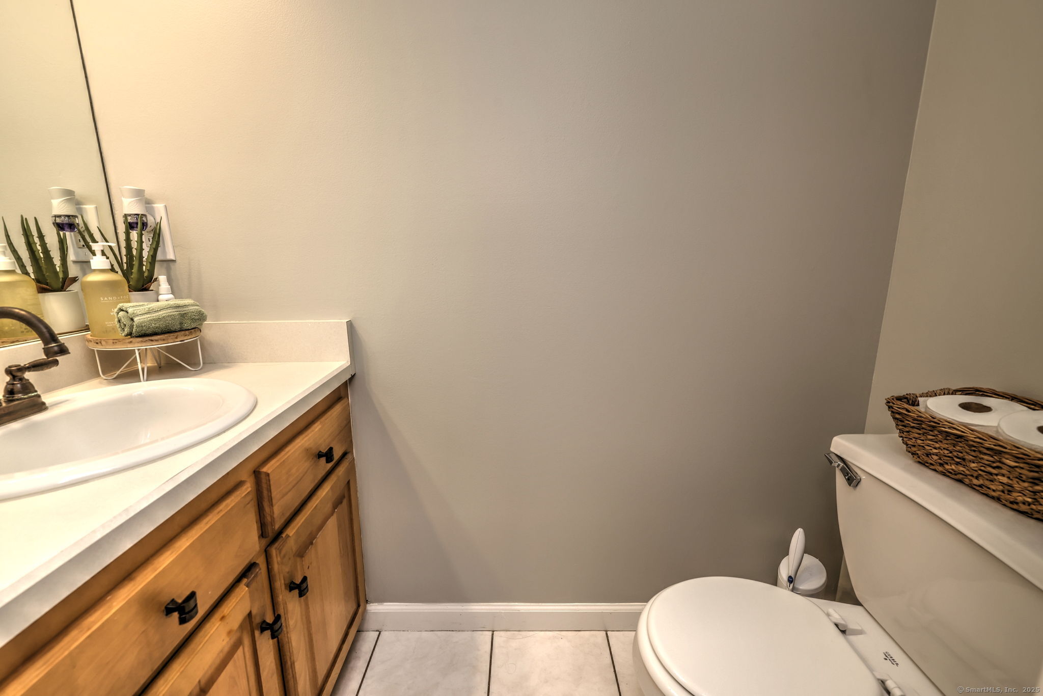 28 Edgewood Avenue Shelton, CT 06484 - Photo 21 of 40 a bathroom with a sink a toilet and vanity