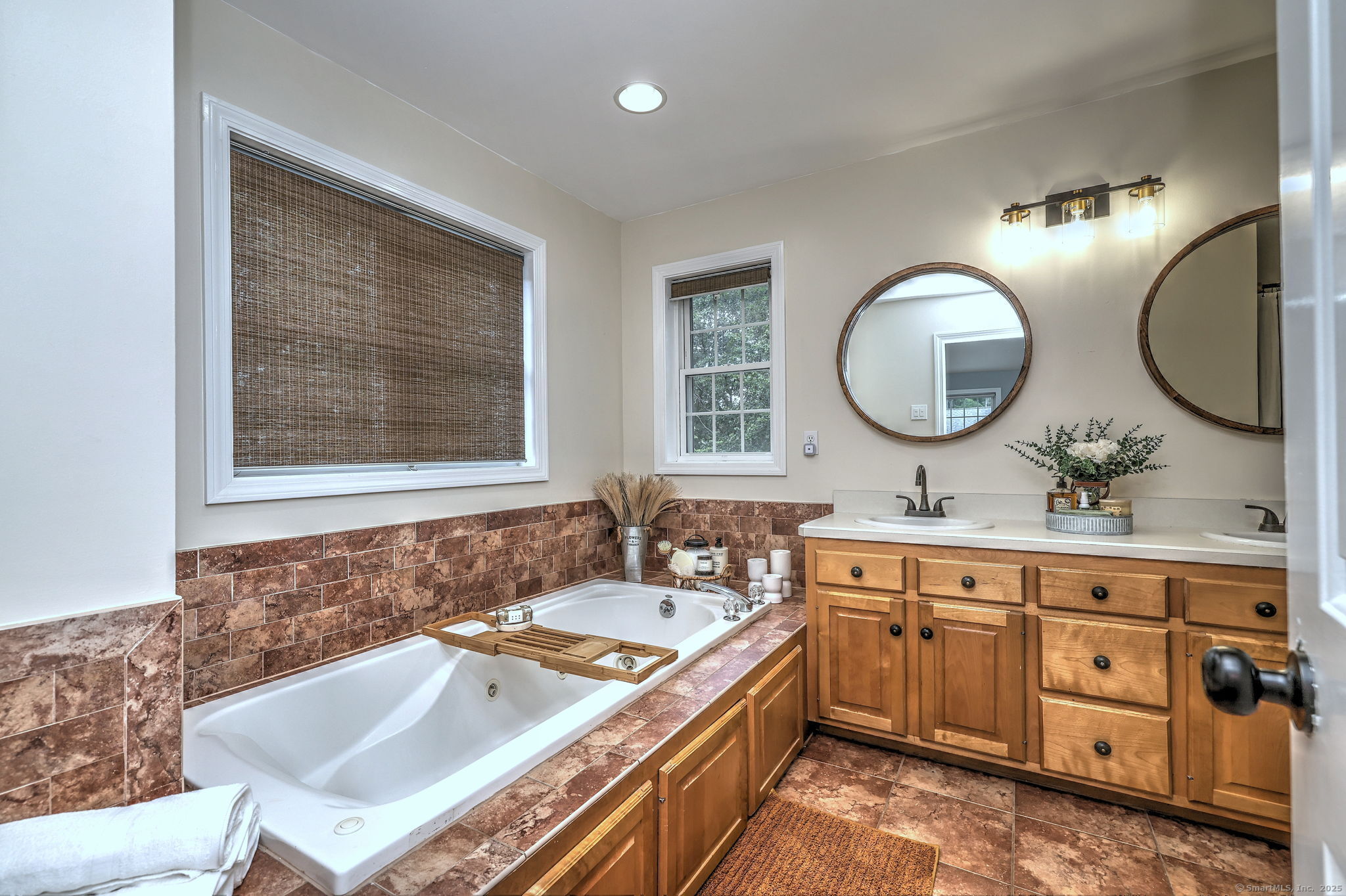 28 Edgewood Avenue Shelton, CT 06484 - Photo 26 of 40 a bathroom with a double vanity sink and a mirror