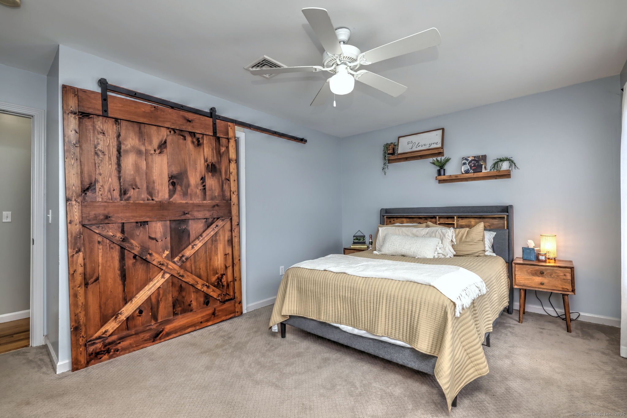 28 Edgewood Avenue Shelton, CT 06484 - Photo 28 of 40 a bedroom with a bed and a chandelier