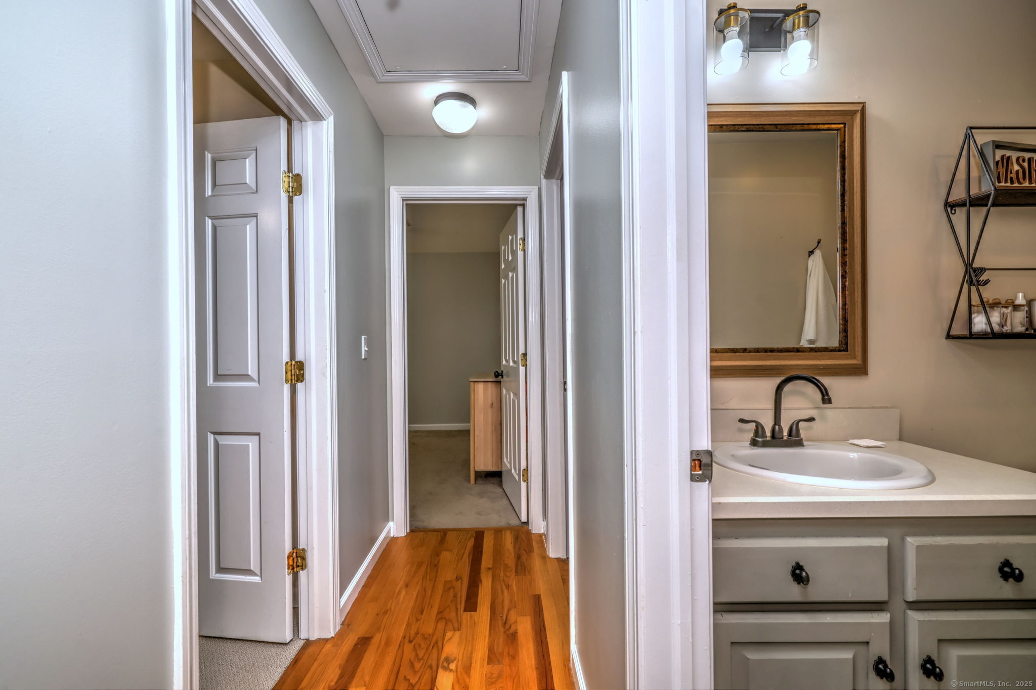 28 Edgewood Avenue Shelton, CT 06484 - Photo 29 of 40 a en suite bathroom with a sink mirror and a shower
