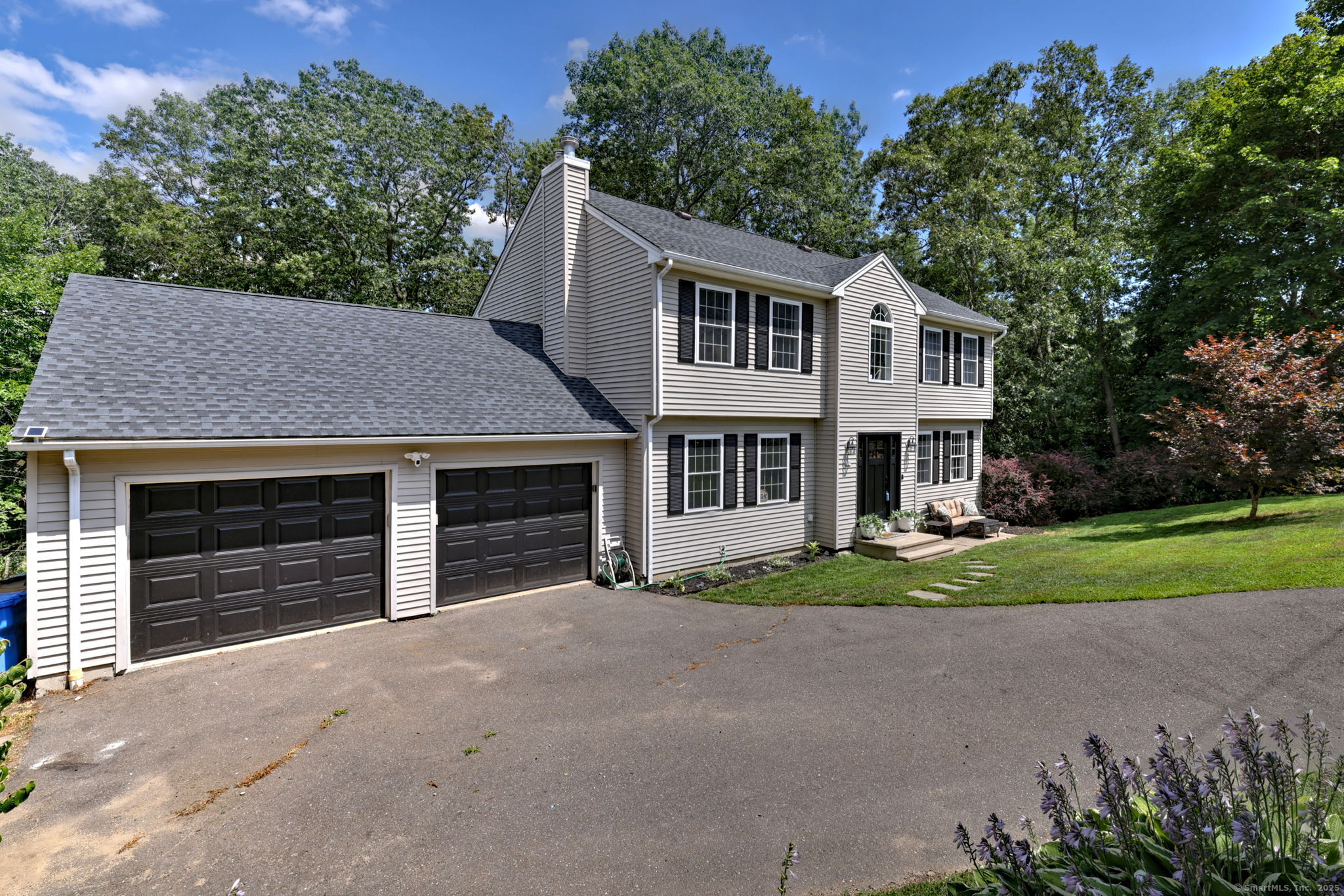 28 Edgewood Avenue Shelton, CT 06484 - Photo 3 of 40 a front view of a house with a yard and garage