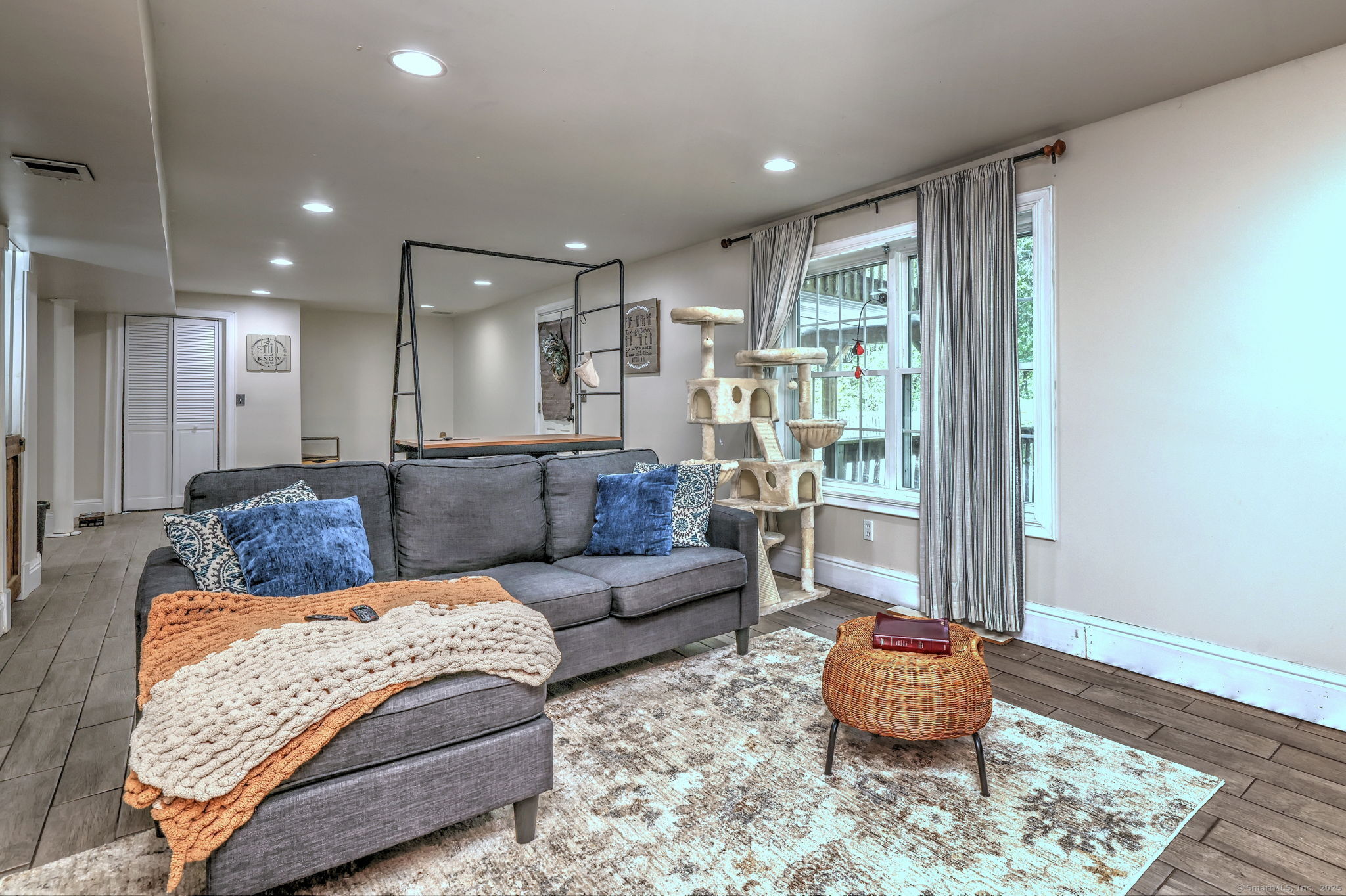 28 Edgewood Avenue Shelton, CT 06484 - Photo 35 of 40 a living room with furniture and a rug