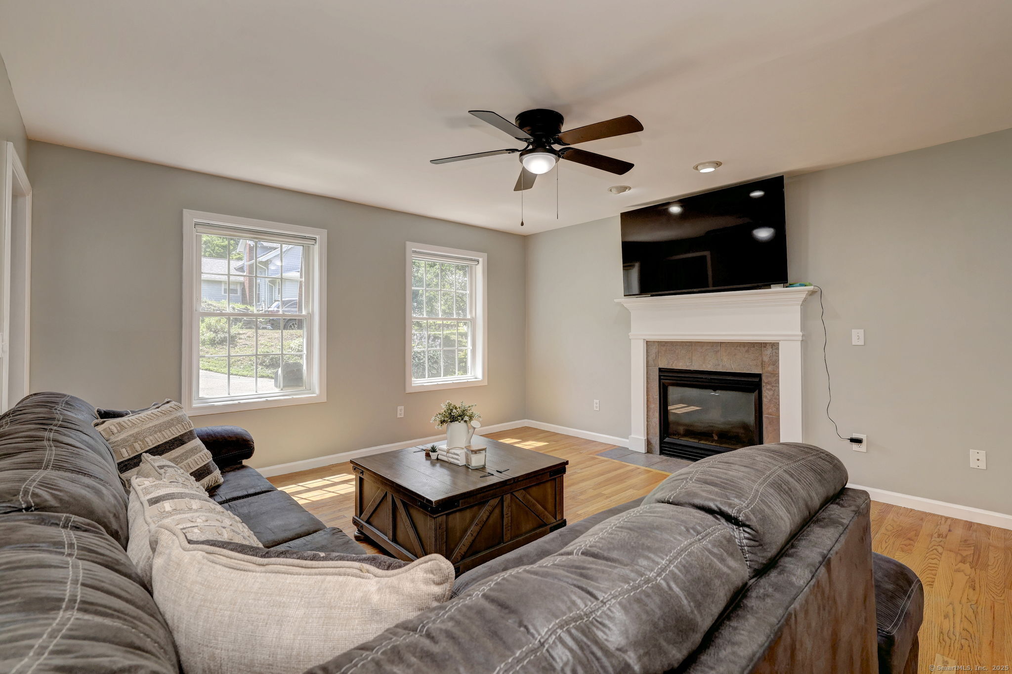 28 Edgewood Avenue Shelton, CT 06484 - Photo 10 of 40 a living room with furniture and a fireplace