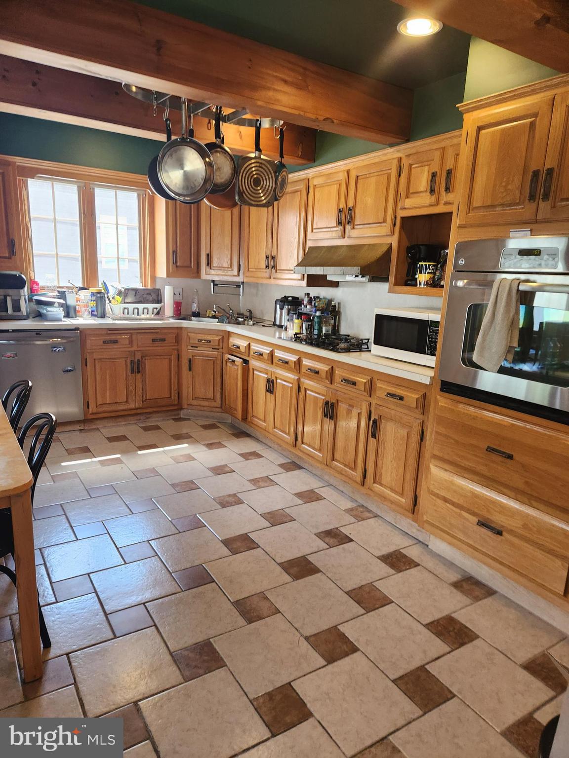 122 Cornell Road Glassboro, NJ 08028 - Photo 6 of 13 a kitchen with stainless steel appliances a stove a sink and a refrigerator
