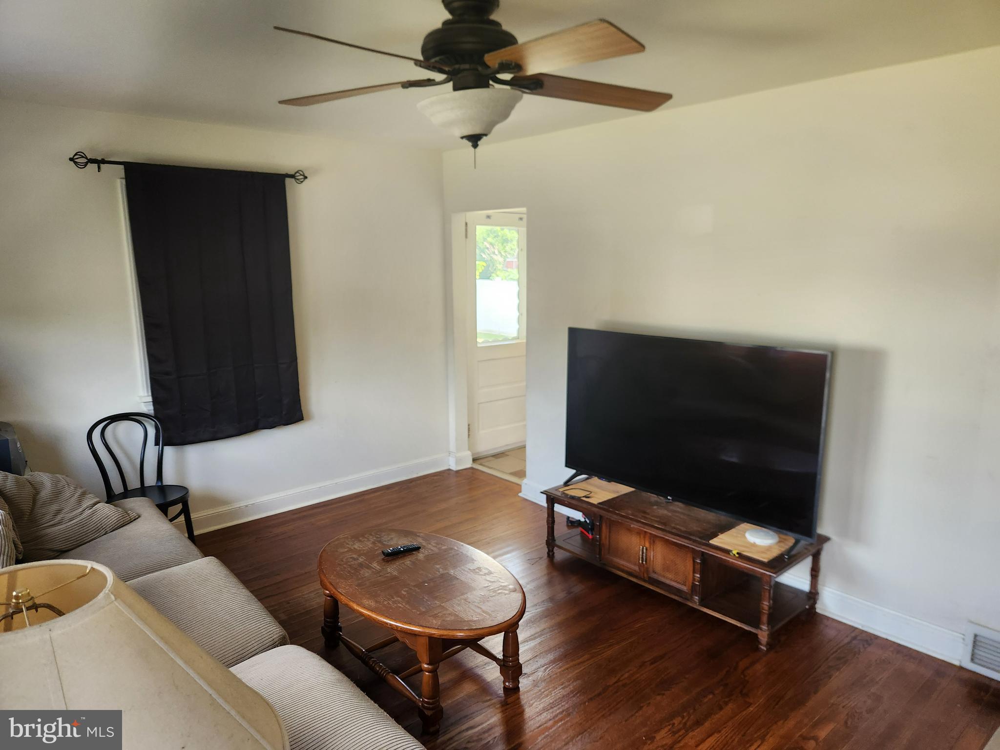 122 Cornell Road Glassboro, NJ 08028 - Photo 8 of 13 a living room with furniture and a flat screen tv
