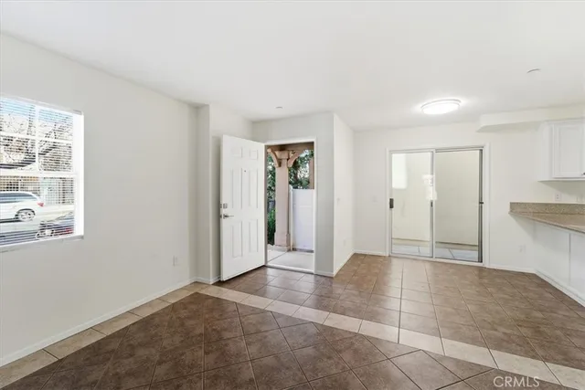 a view of livingroom with an empty space and a window