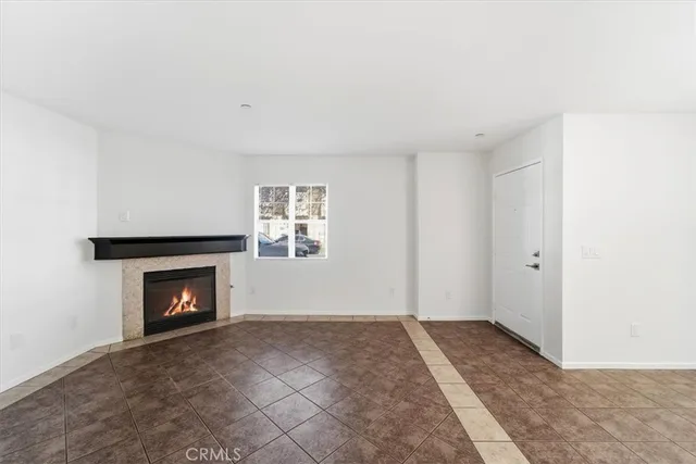 a view of an empty room with fire place