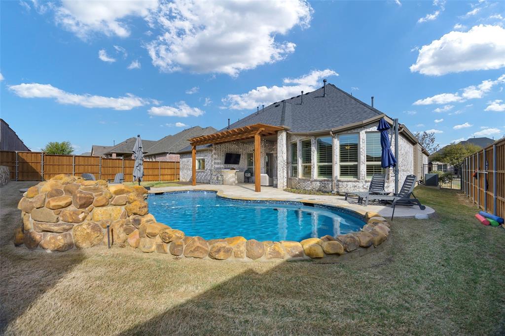 1220 Packsaddle Trail Prosper, TX 75078 - Photo 12 of 33 a view of a house with pool and sitting area