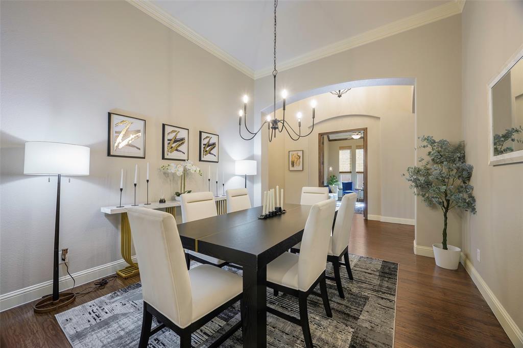 1220 Packsaddle Trail Prosper, TX 75078 - Photo 14 of 33 a view of a dining room with furniture and wooden floor