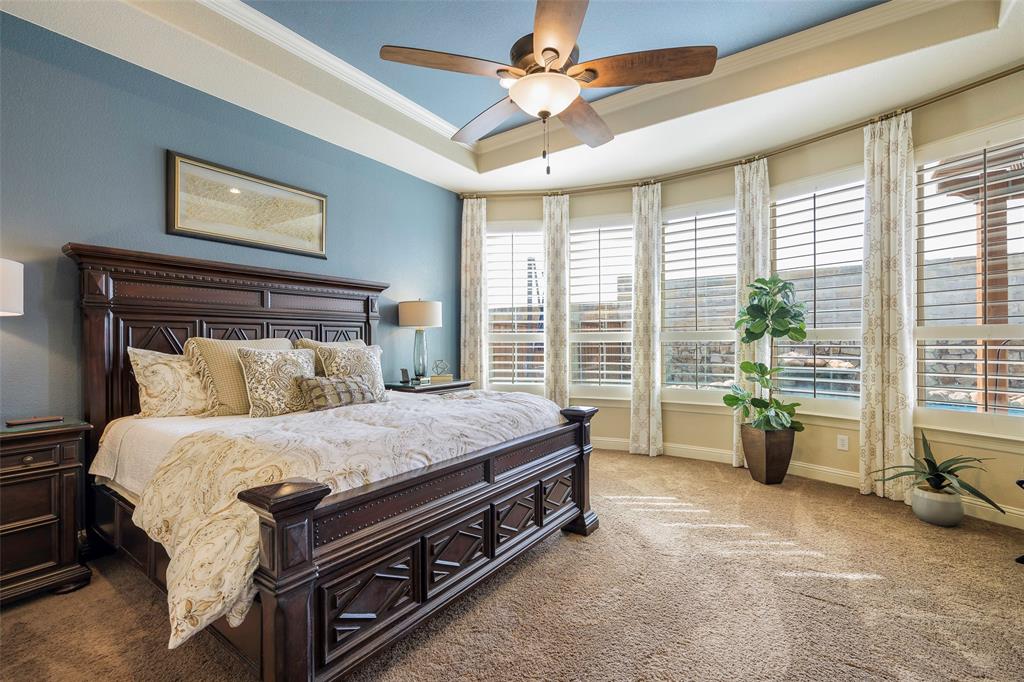 1220 Packsaddle Trail Prosper, TX 75078 - Photo 16 of 33 a bed sitting in a spacious bedroom next to a window